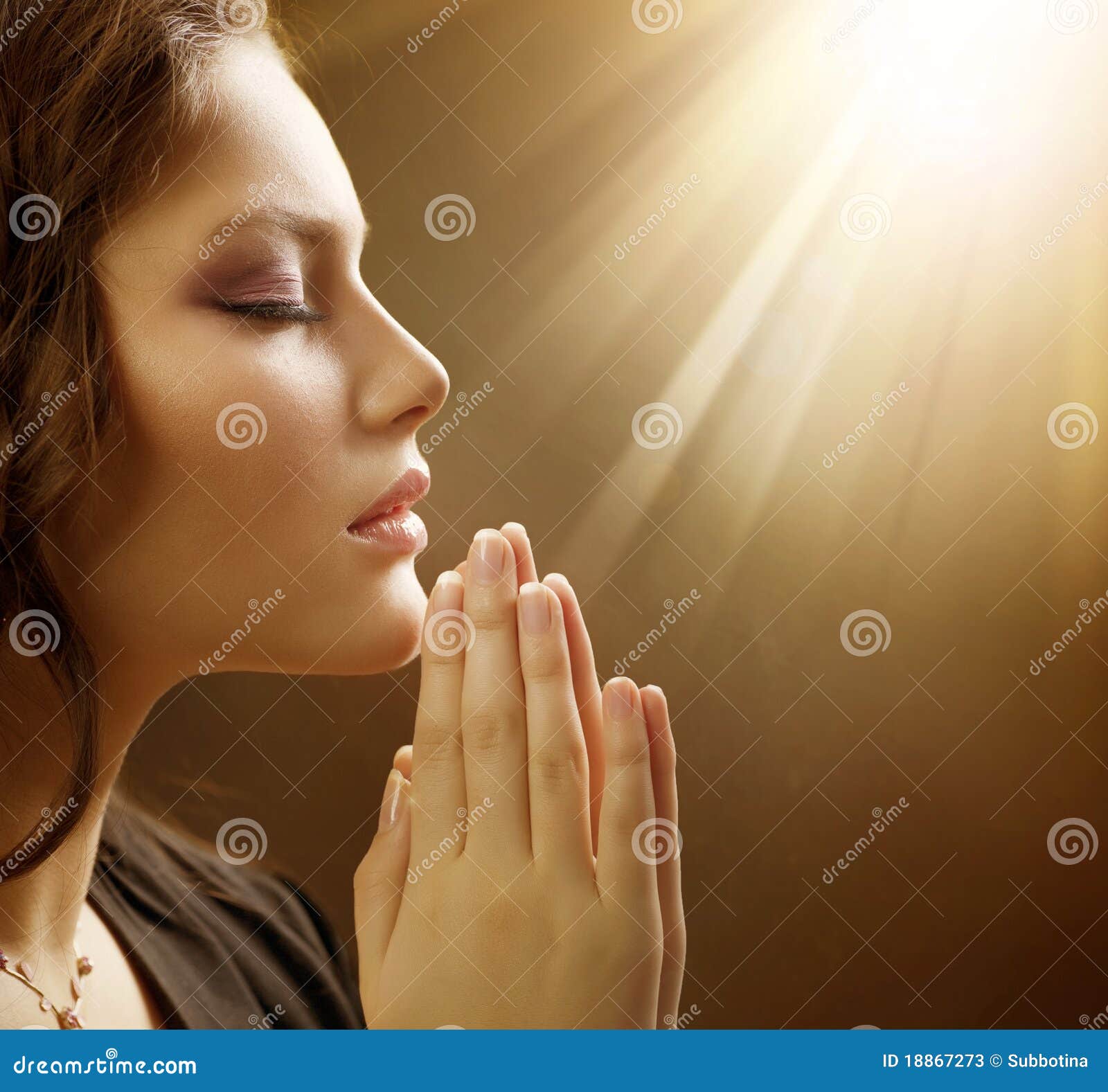 young woman praying close-up