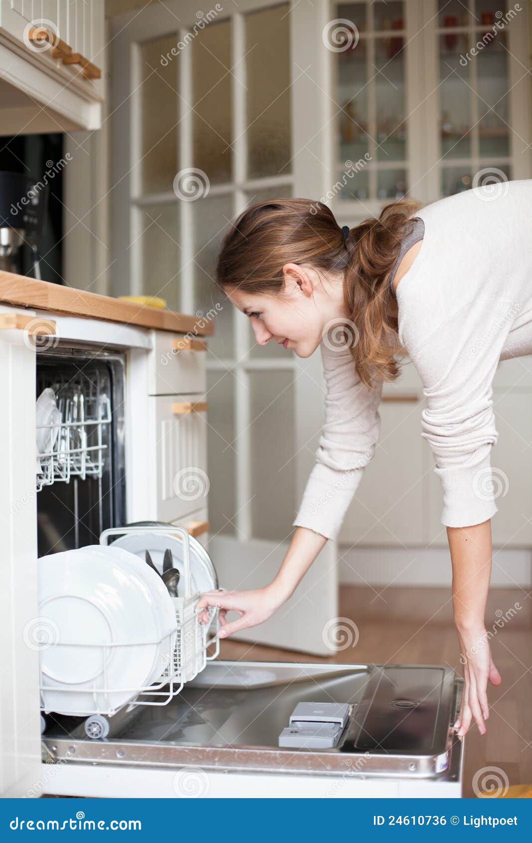 Young Woman Putting Dishes in the Dishwasher Stock Photo Image of