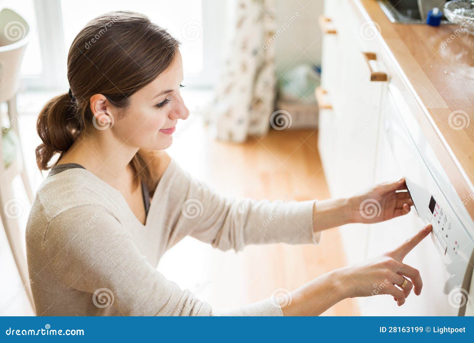 Young Woman Putting Dishes in the Dishwasher Stock Image Image of