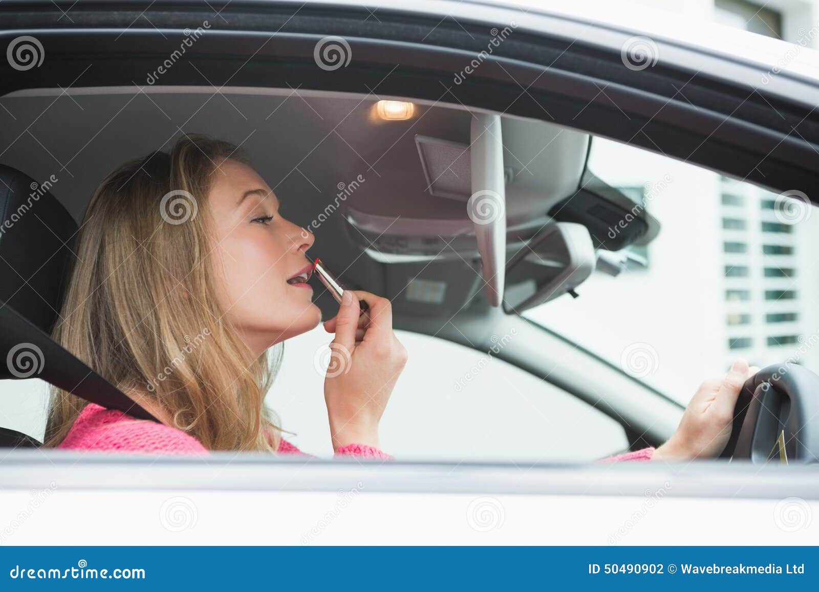 Young Woman Putting on Makeup Stock Photo Image of dealership, adult