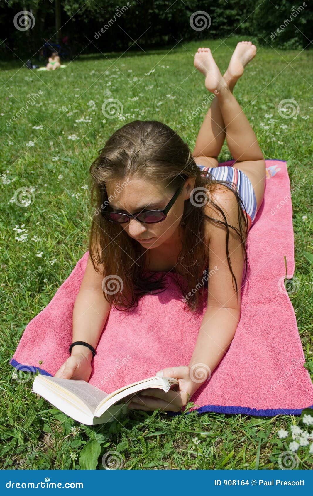 young woman reading in park