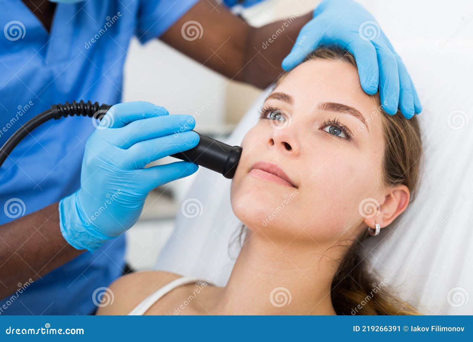 Young Woman Receiving Face Ultrasound Lifting Procedure In Clinic Stock