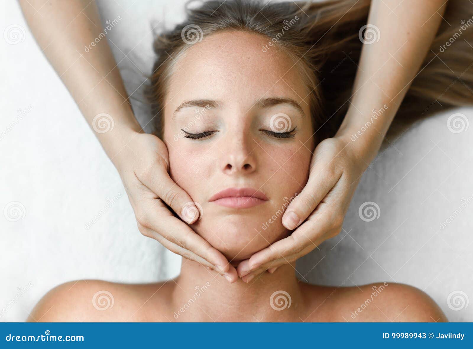 Young Woman Receiving A Head Massage In A Spa Center Stock Image