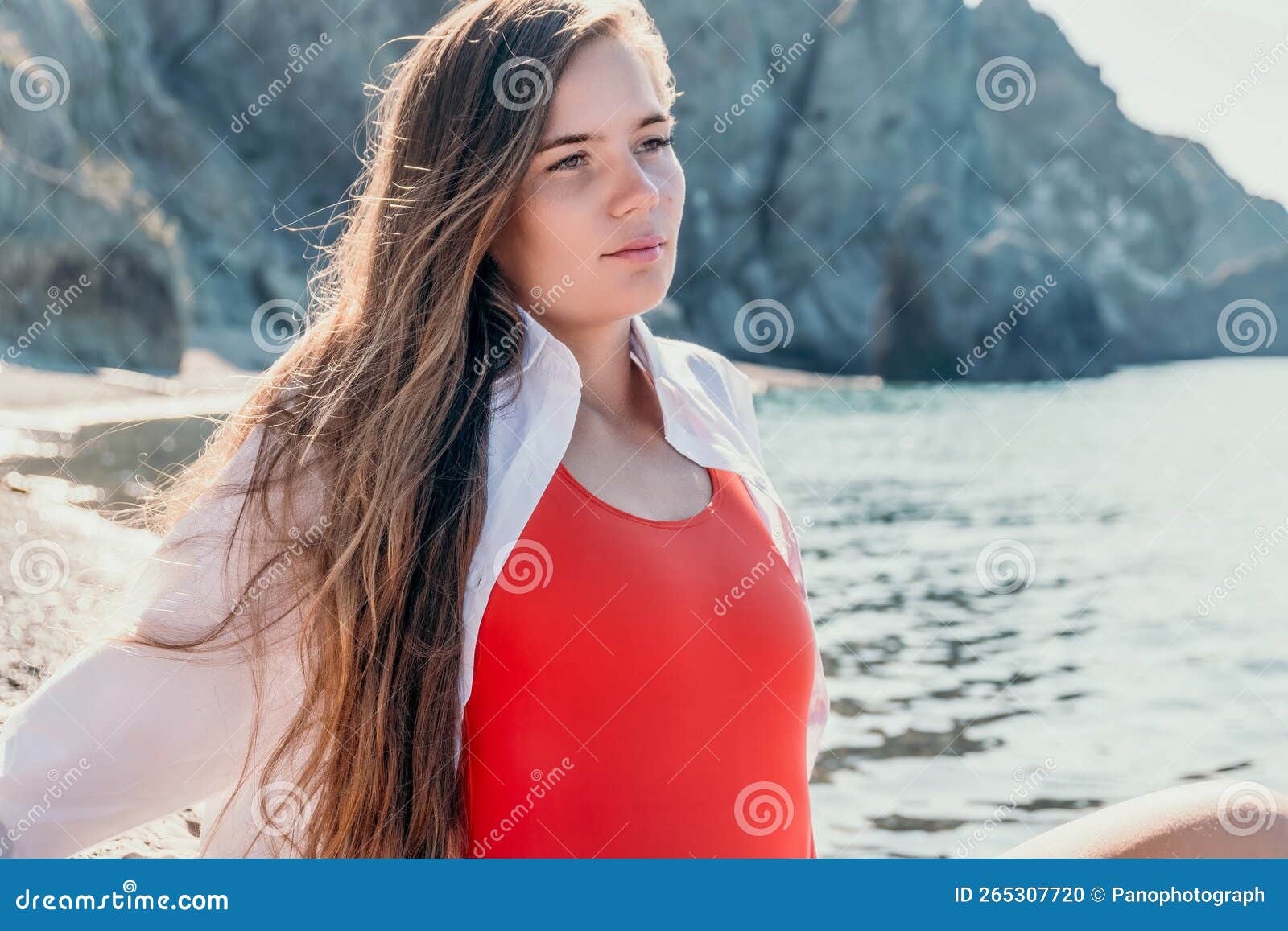 Young Woman In Red Bikini On Beach Girl Lying On Pebble Beach And Enjoying Sun Happy Lady With