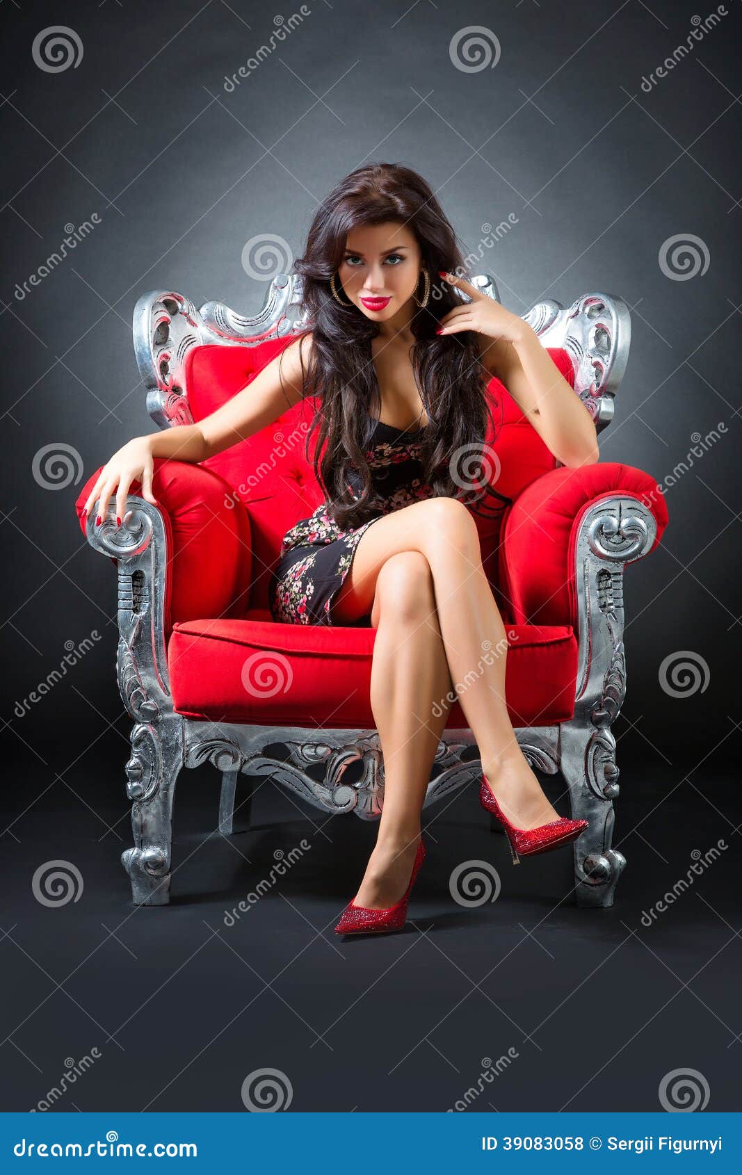 Young woman in a red chair. Retro style.