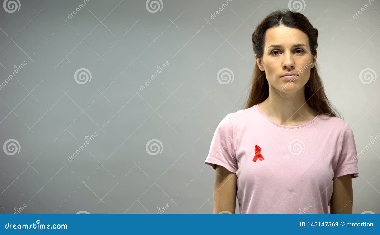 Young Woman with Red Ribbon on Shirt Looking in Camera, HIV AIDS ...