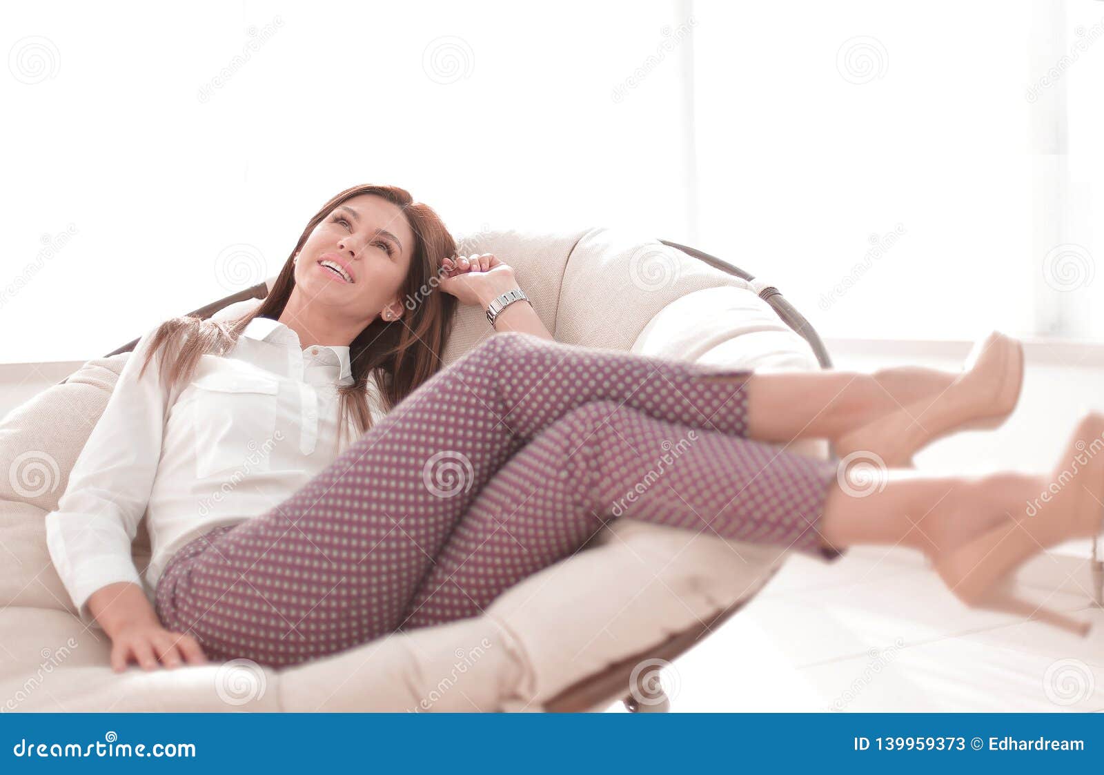 Young Woman Relaxes In A Comfortable Chair Stock Image Image Of 