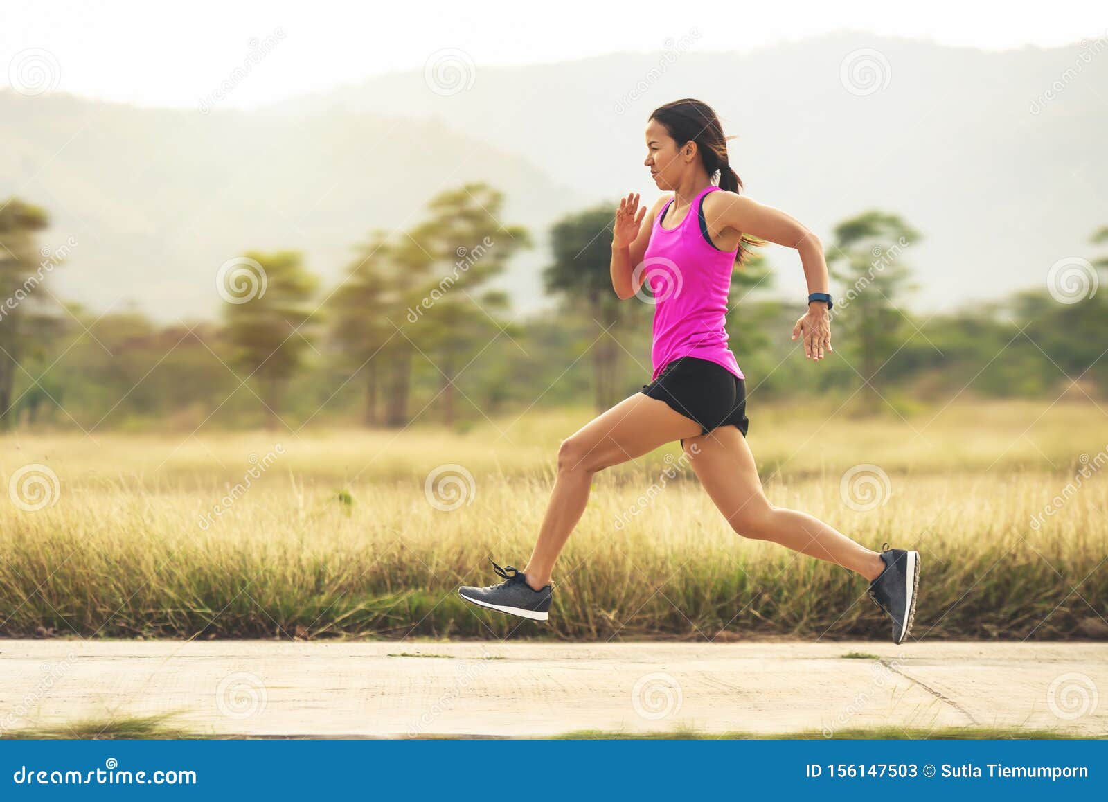 Fitness woman runner running on summer park in the morning Stock Photo by  lzf