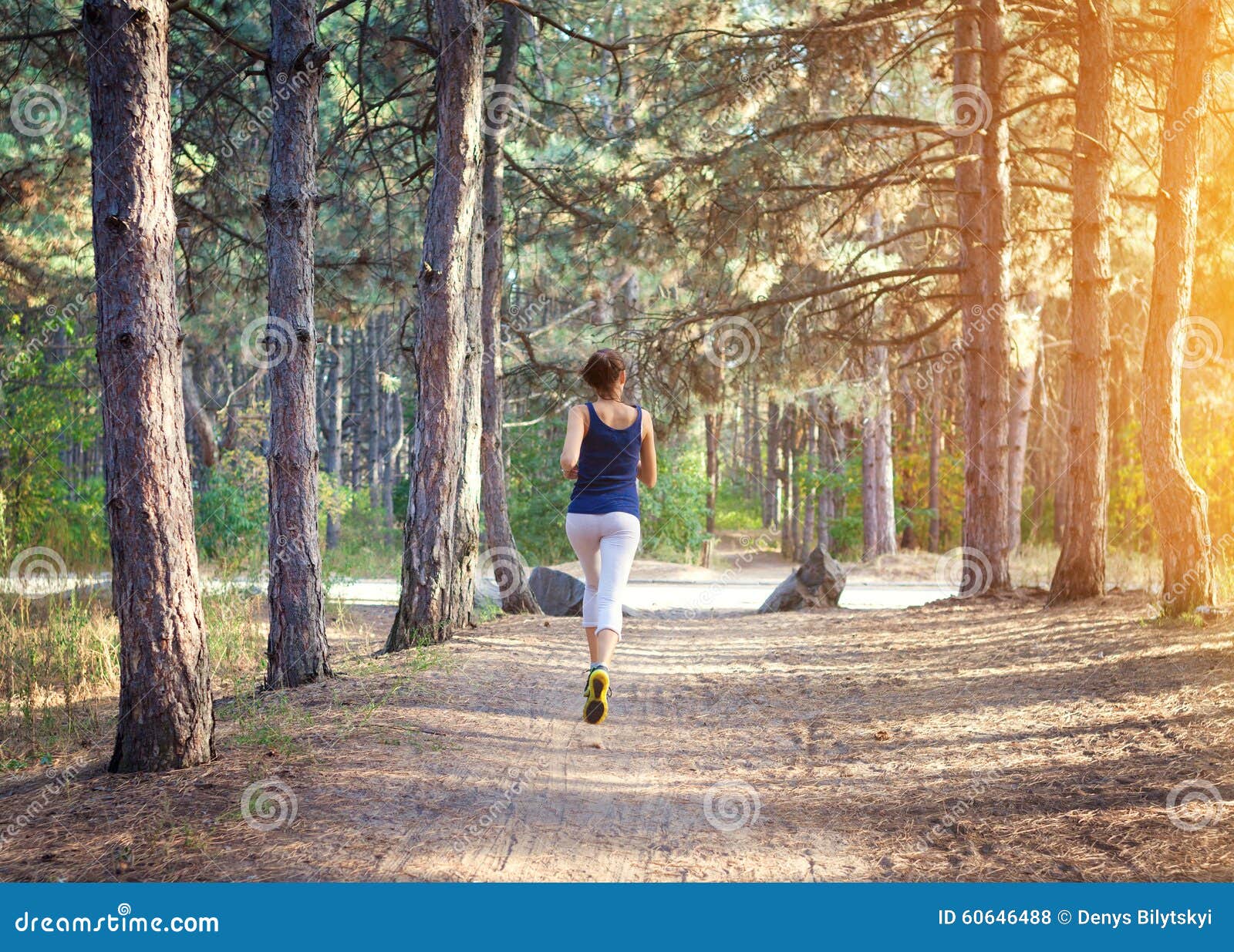 Young Woman Running on a Rural Road in Forest Stock Photo - Image of ...