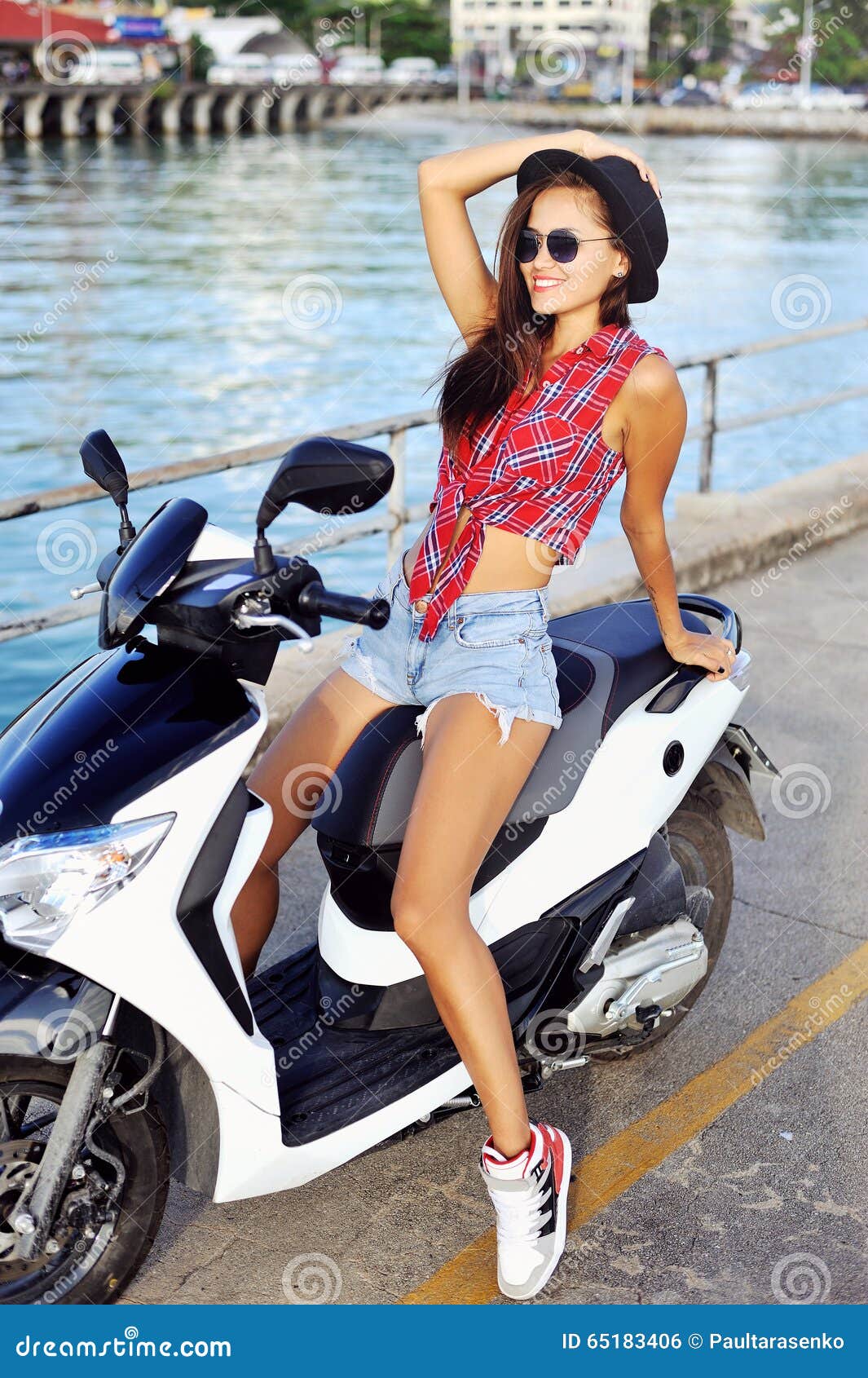Young woman on a scooter stock photo. Image of portrait 65183406