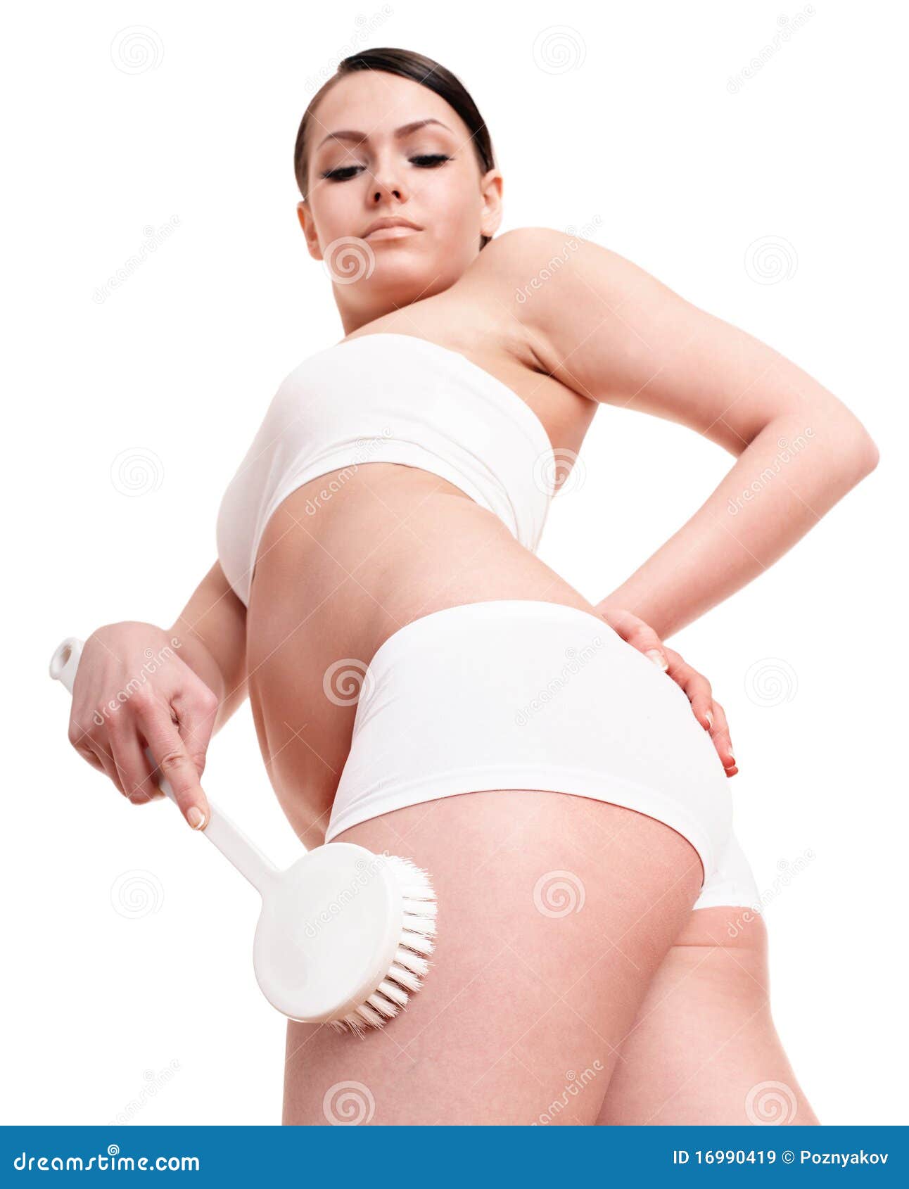 young woman scrubbing body.