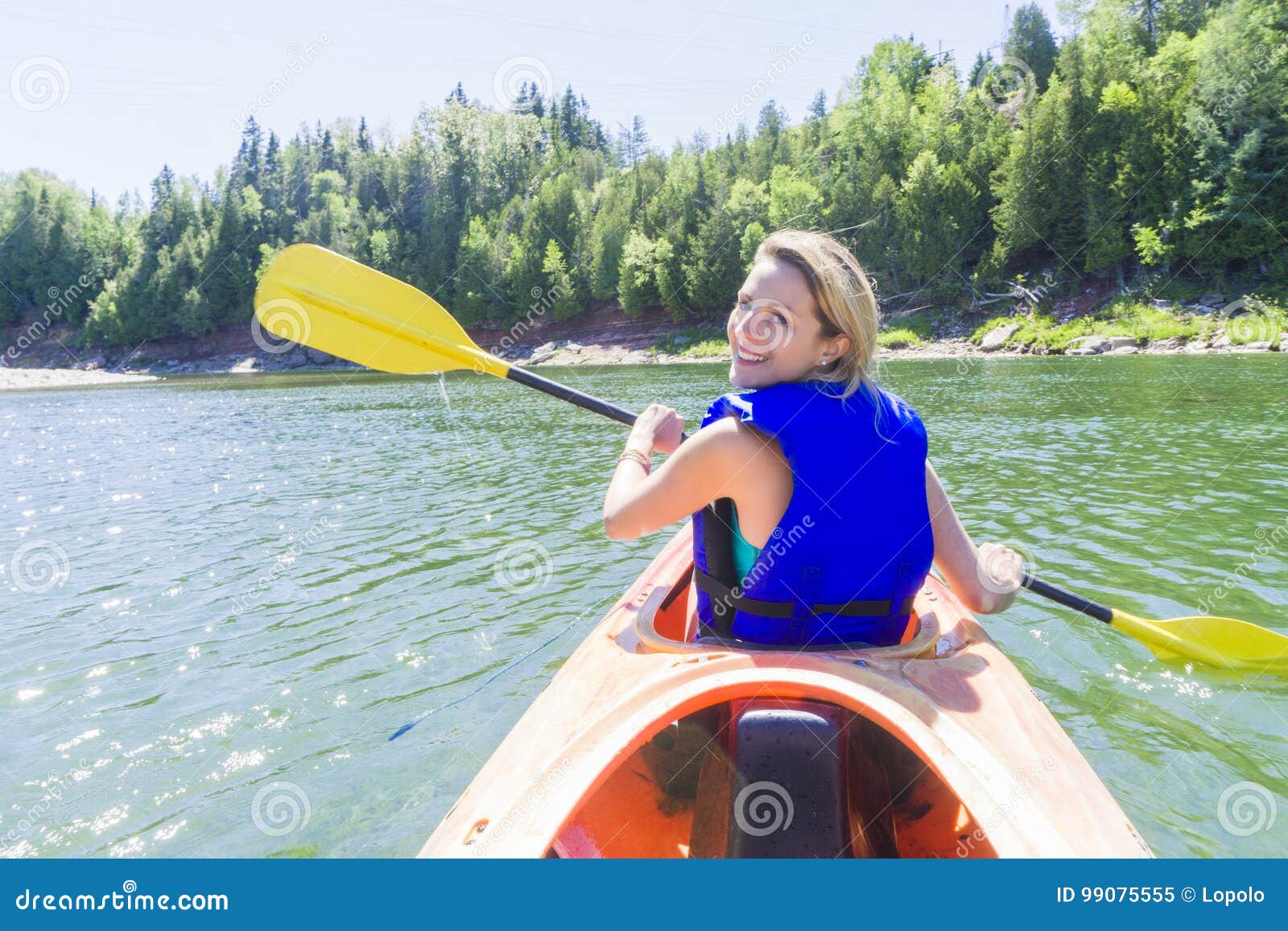 Young woman sea kayaking stock image. Image of person - 99075555