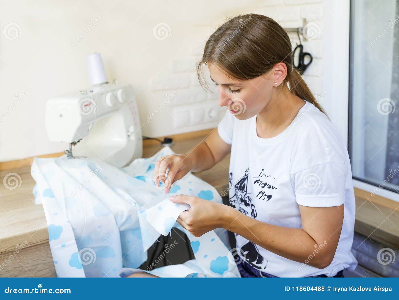 Young Woman Sewing Clothes with Sewing Machine. Stock Photo Image of