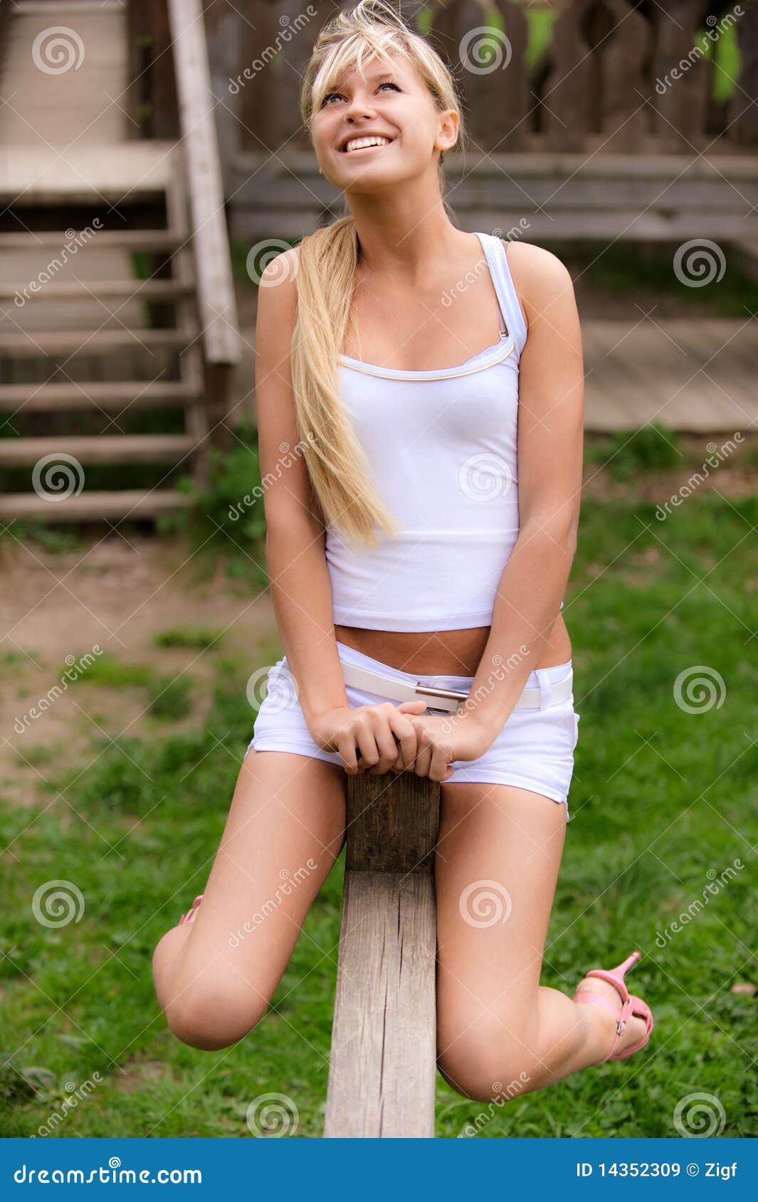 young woman shakes on seesaw