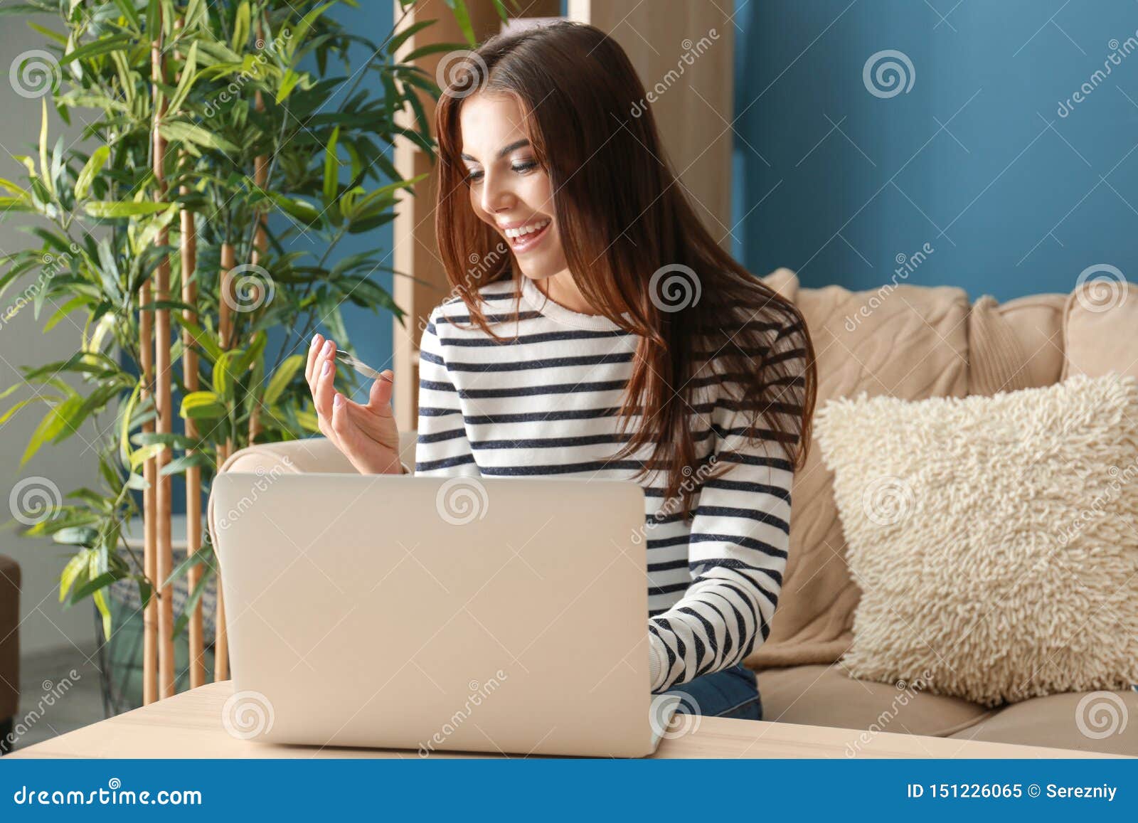 Young Woman Shopping Online with Credit Card and Laptop at Home Stock ...