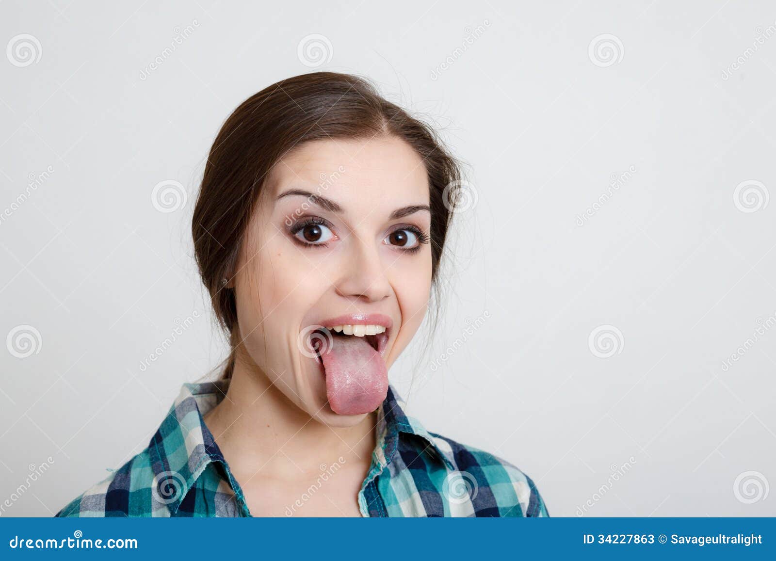 Young Woman Showing Her Tongue Stock Image - Image of indoors ...