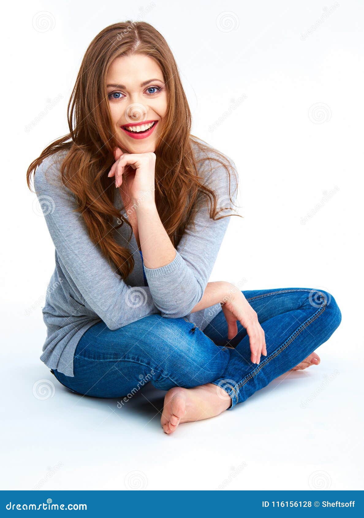 Young Woman Sitting on a Floor. Isolated on White Background Stock ...