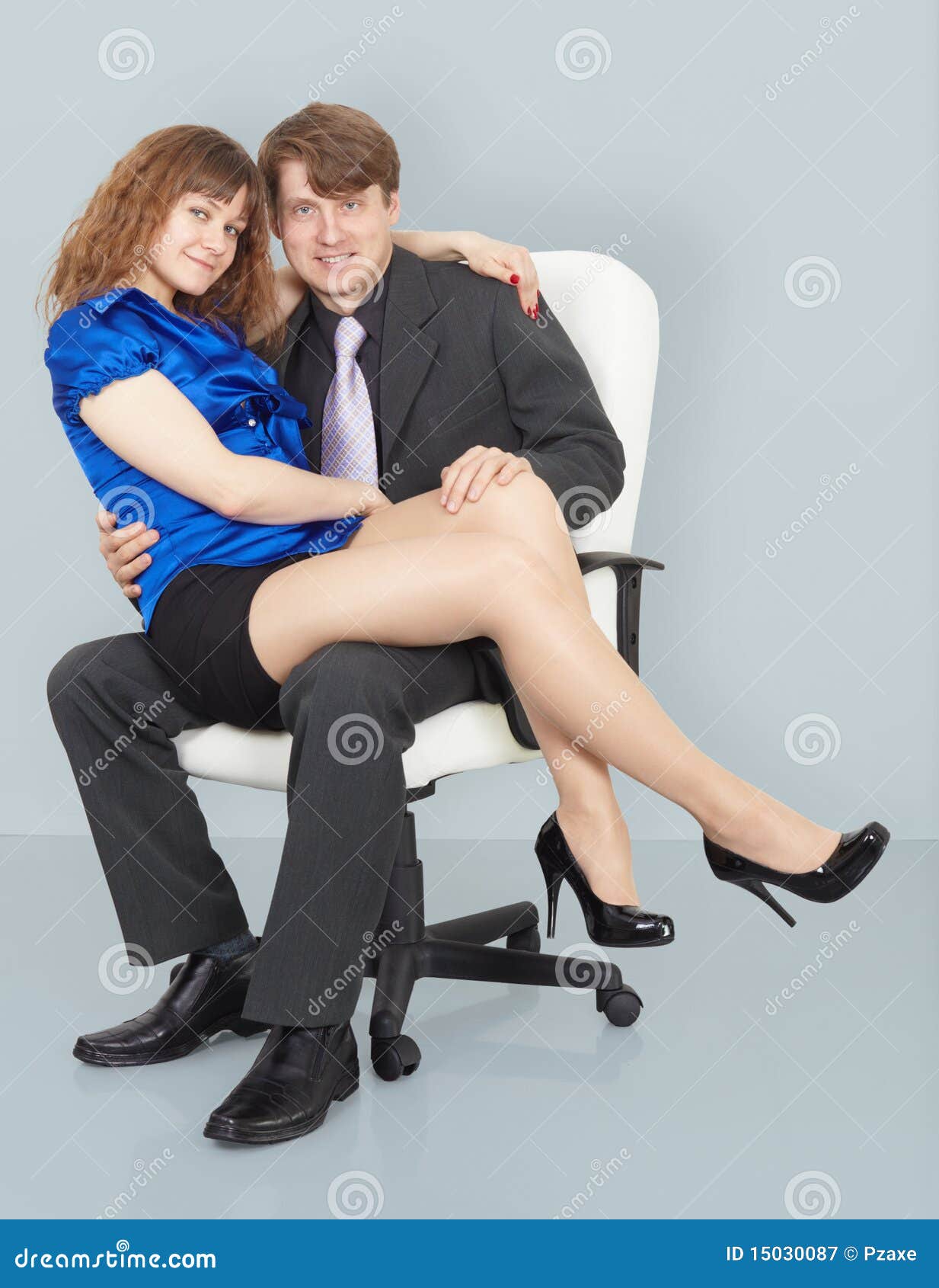 Young Woman Sitting On Lap Of A Man Sto