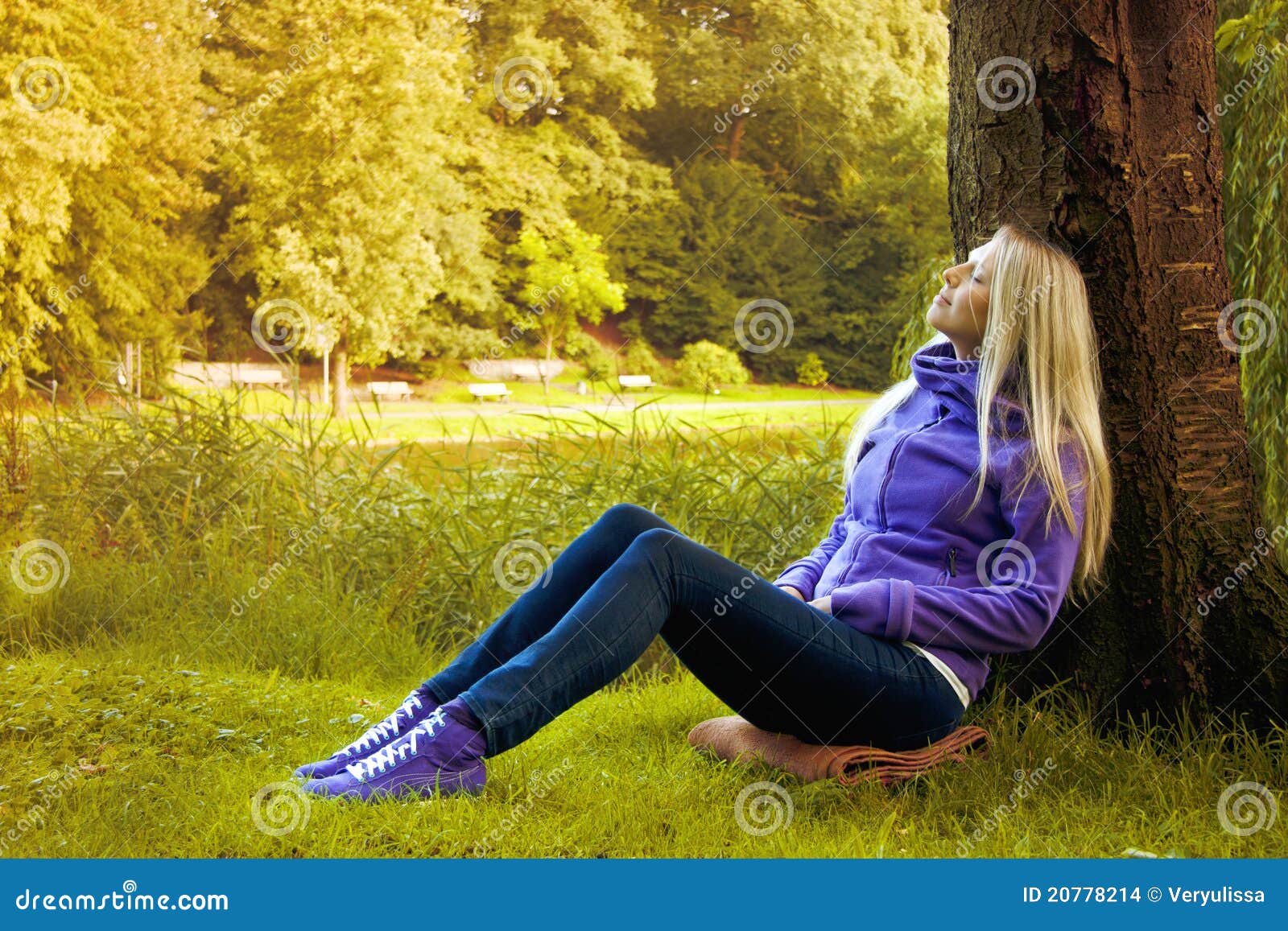 Young Woman Sitting Under a Tree Stock Photo - Image of happy, gold ...