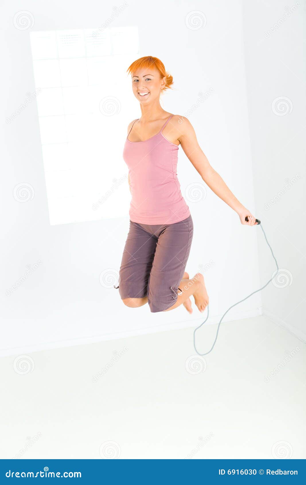 Young woman skipping rope stock photo. Image of gymnastic - 6916030