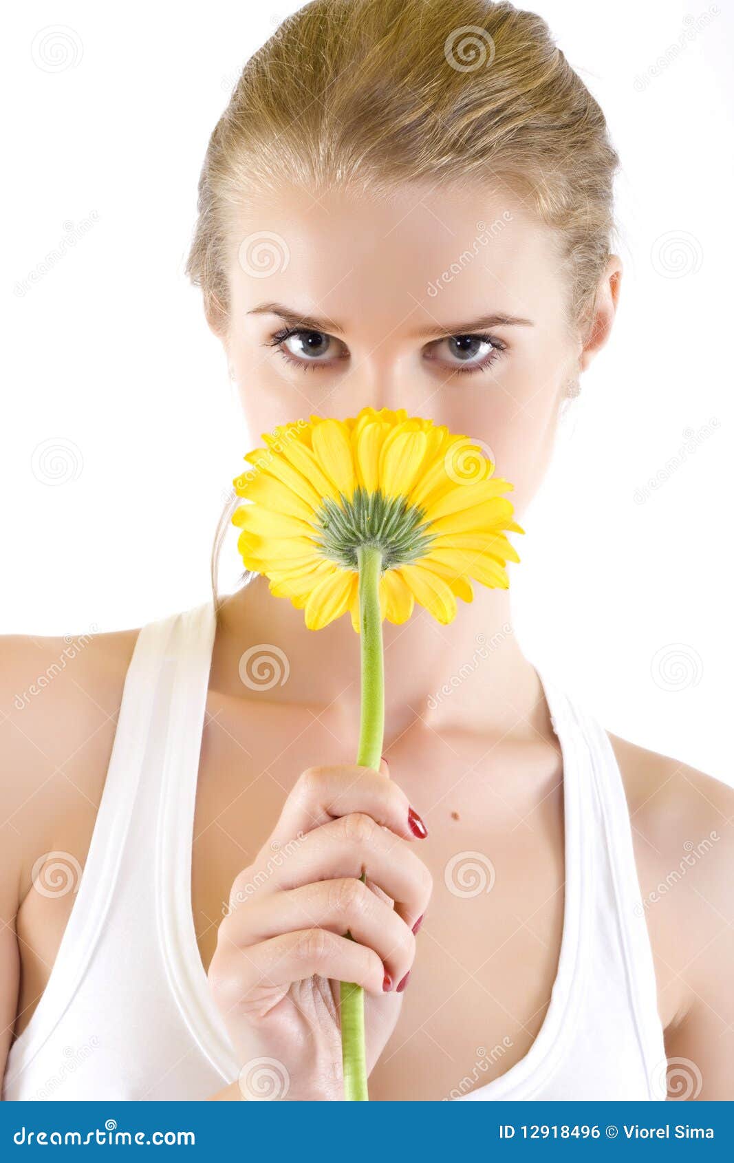 Young Woman Smelling a Yellow Flower Stock Photo Image of