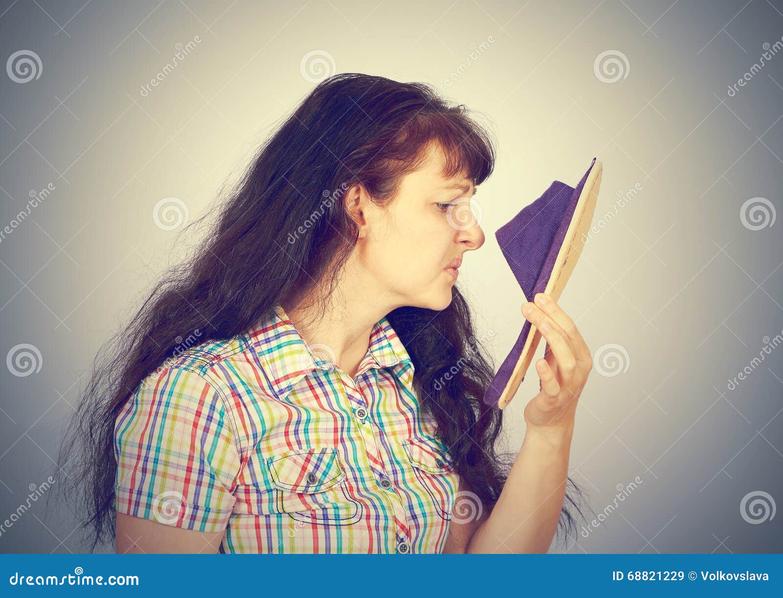 Young Woman Sniffs Smelly Slippers Stock Image Image Of