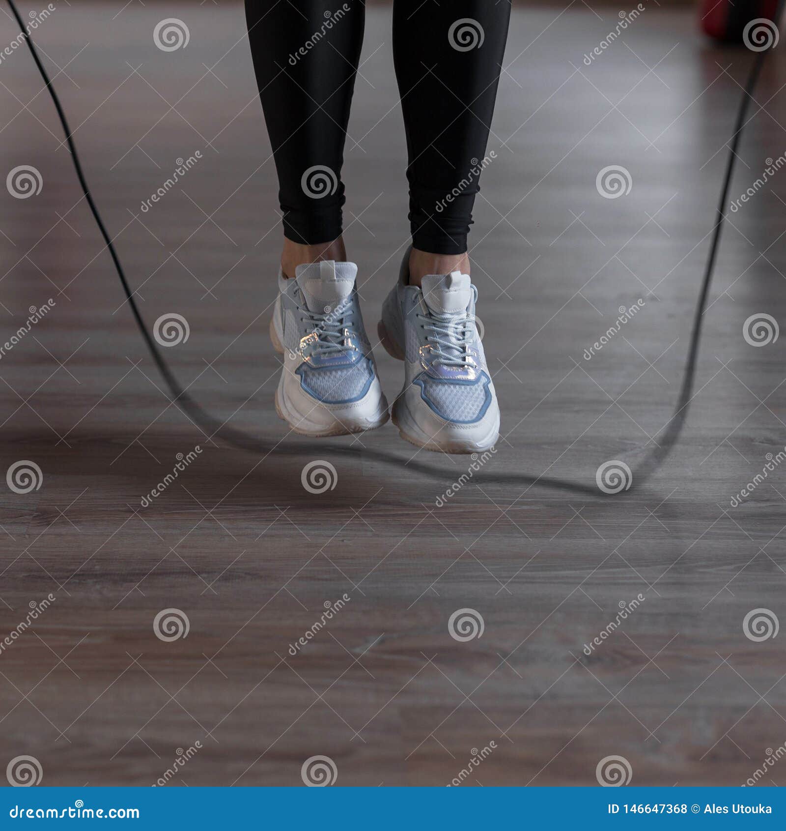 Young Woman in Sports Black Leggings in Stylish Sneakers Do Jumping ...