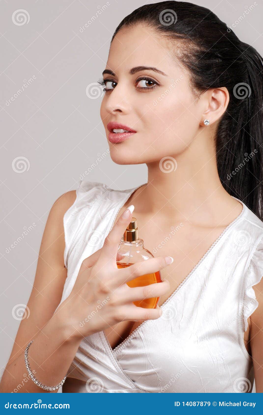 Young Woman Spraying Perfume Stock Image - Image of cologne, fragrance