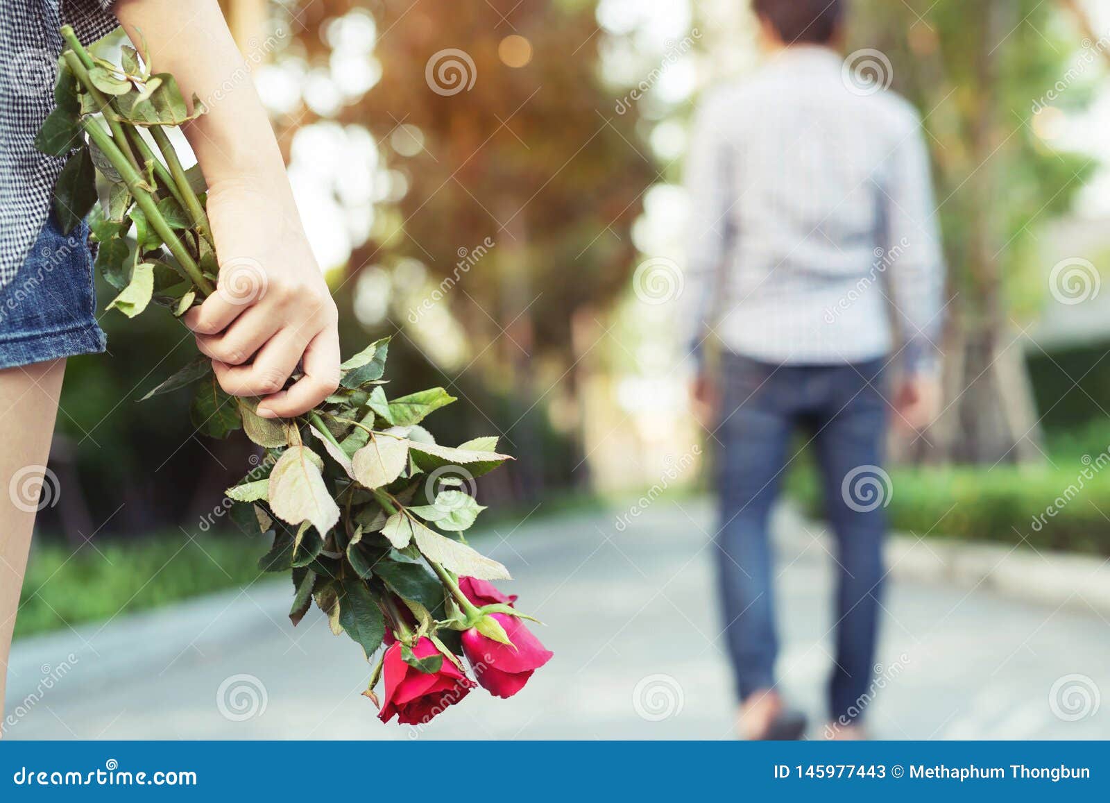 Young Woman Standing with a Red Rose on Hand Sadness Love in ...