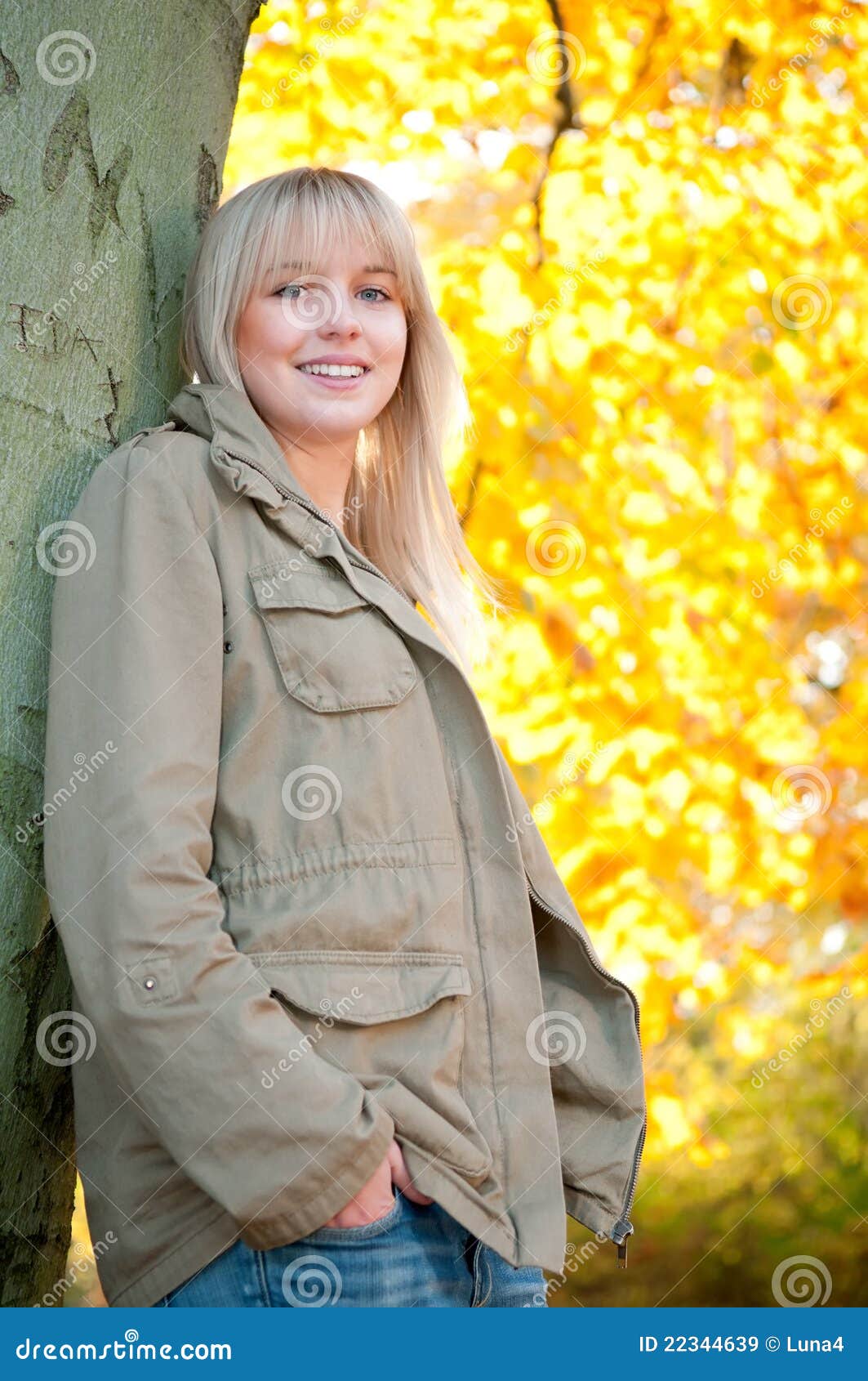 Young Woman Standing on a Tree Stock Image - Image of leaf, looking ...