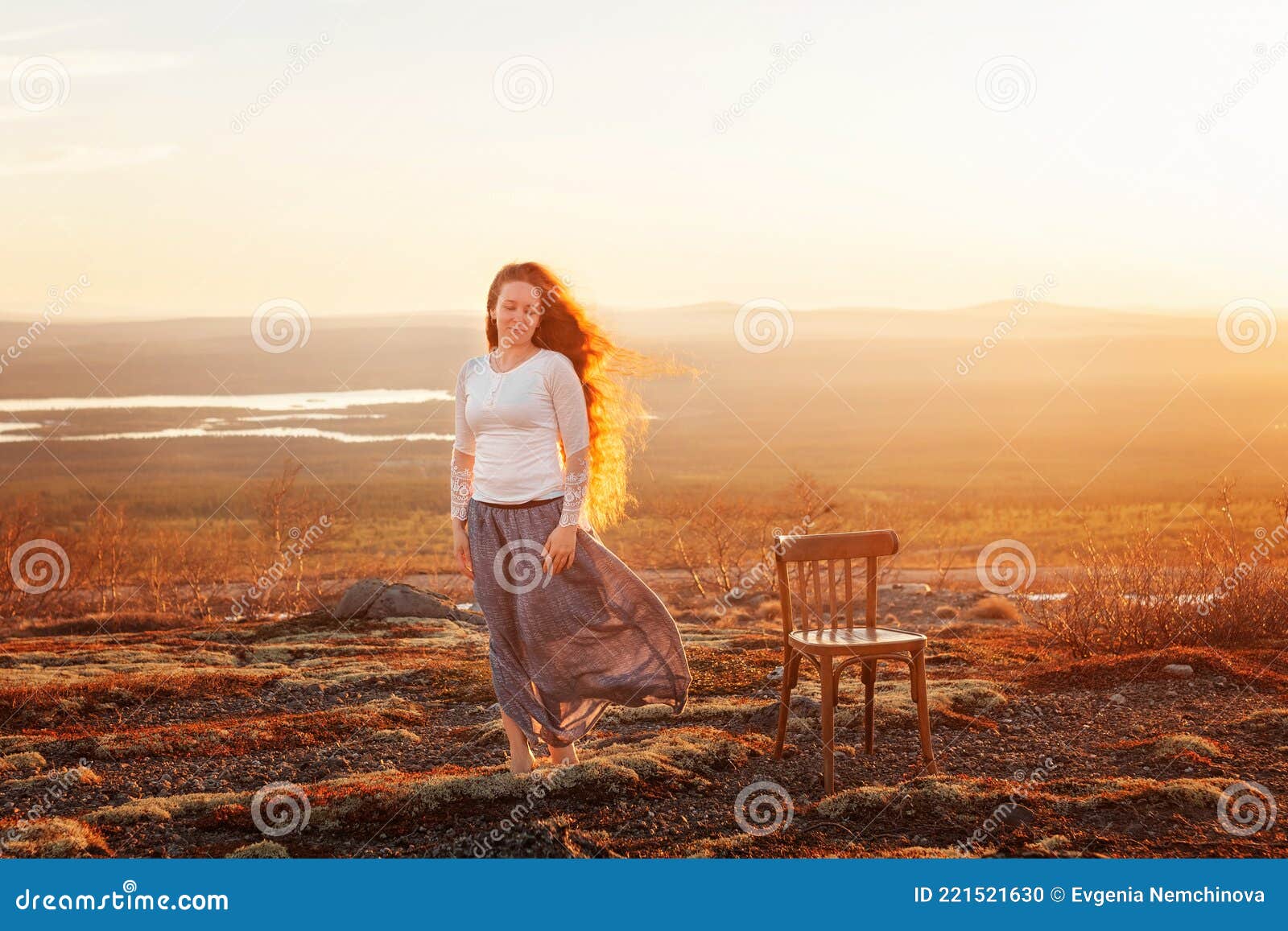 Young Woman Stands Against Backdrop Mountain Sunset, Long Red Hair Blowing  Wind, Chair Stands Behind. Concept Psychology Stock Photo - Image of  beautiful, mountain: 221521630