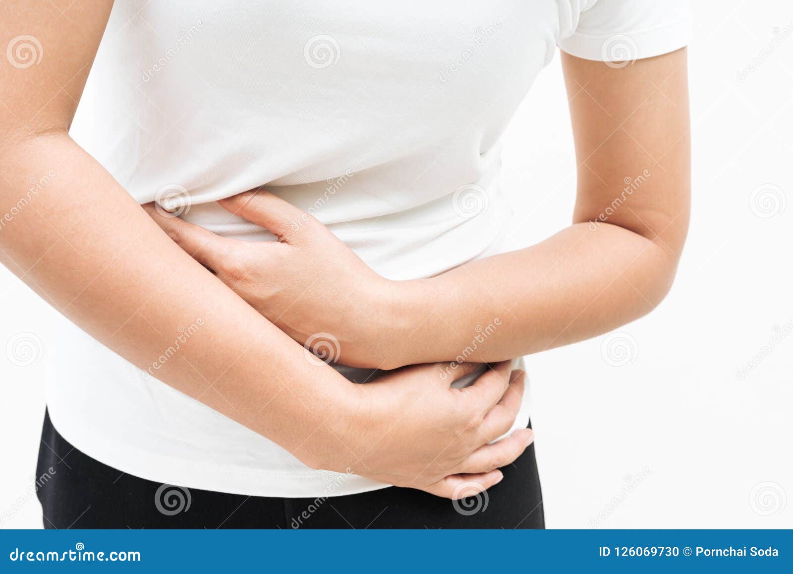 Young woman suffering from backache and flank pain on white background.  Cause of pain include UTI, kidney stones, gallbladder disease or muscle  problems. Health care and medical concept. Stock Photo