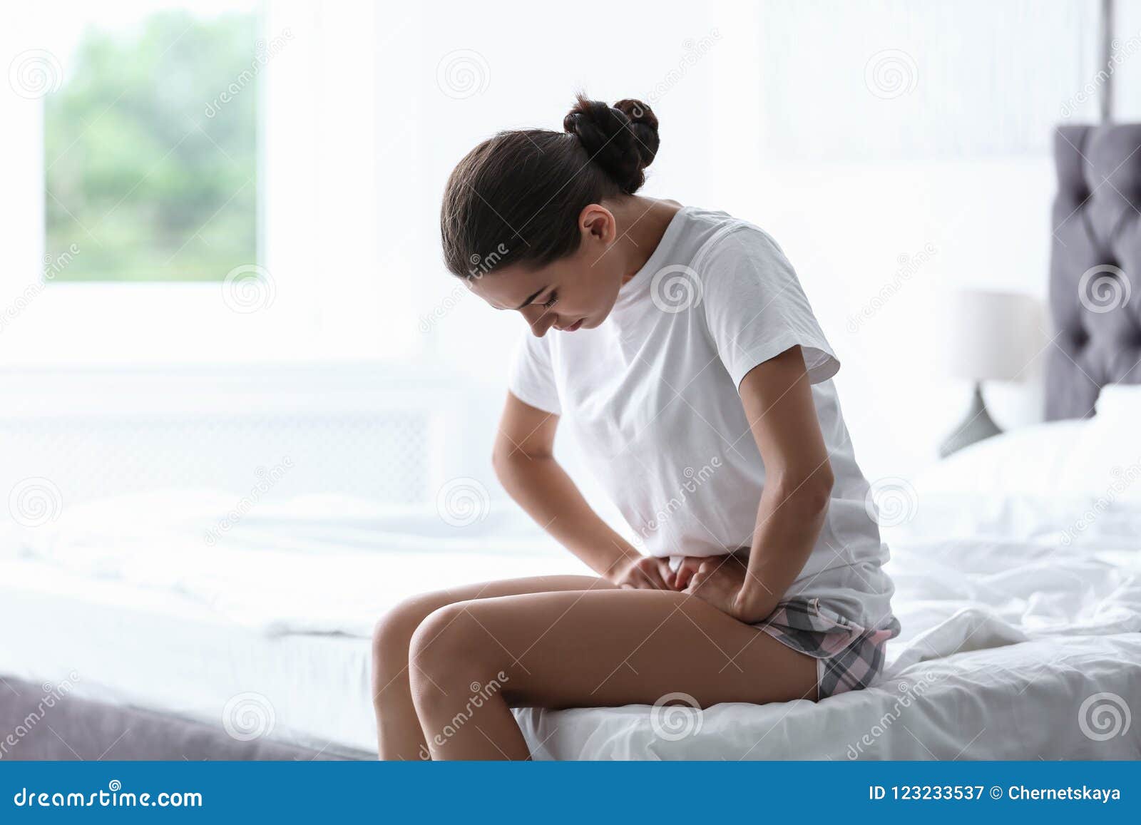 young woman suffering from menstrual cramps