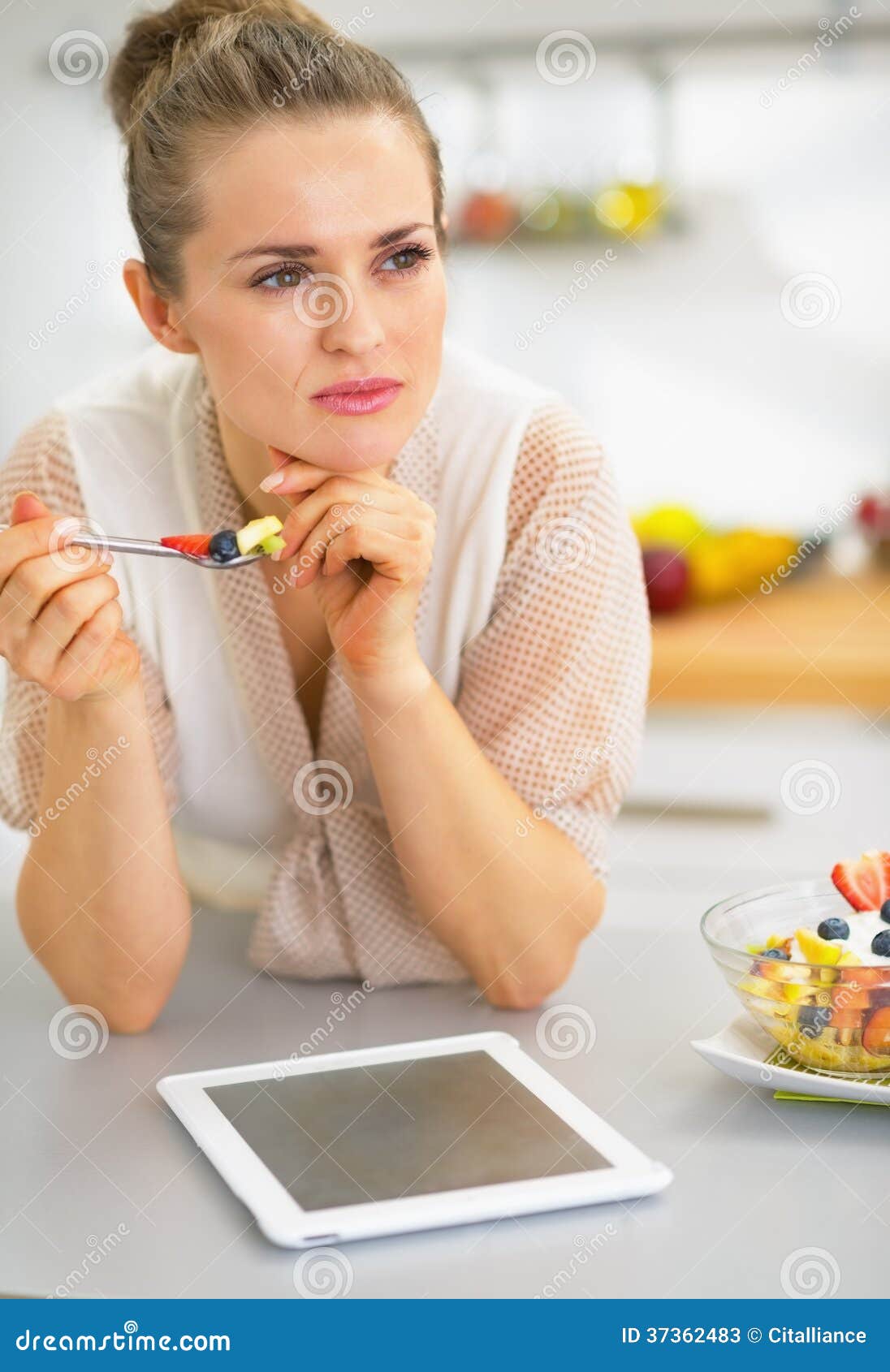 Young Woman with Tablet Pc Eating Fruit Salad Stock Image Image of