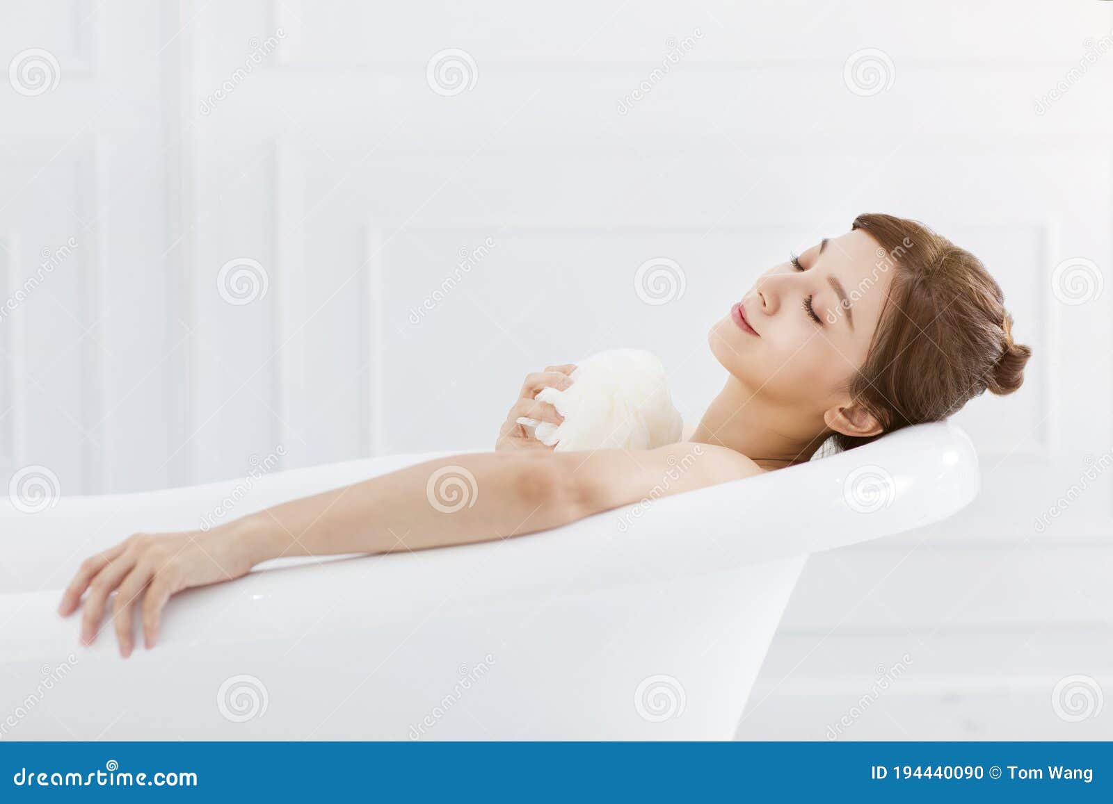 young woman take a bath in bathtub