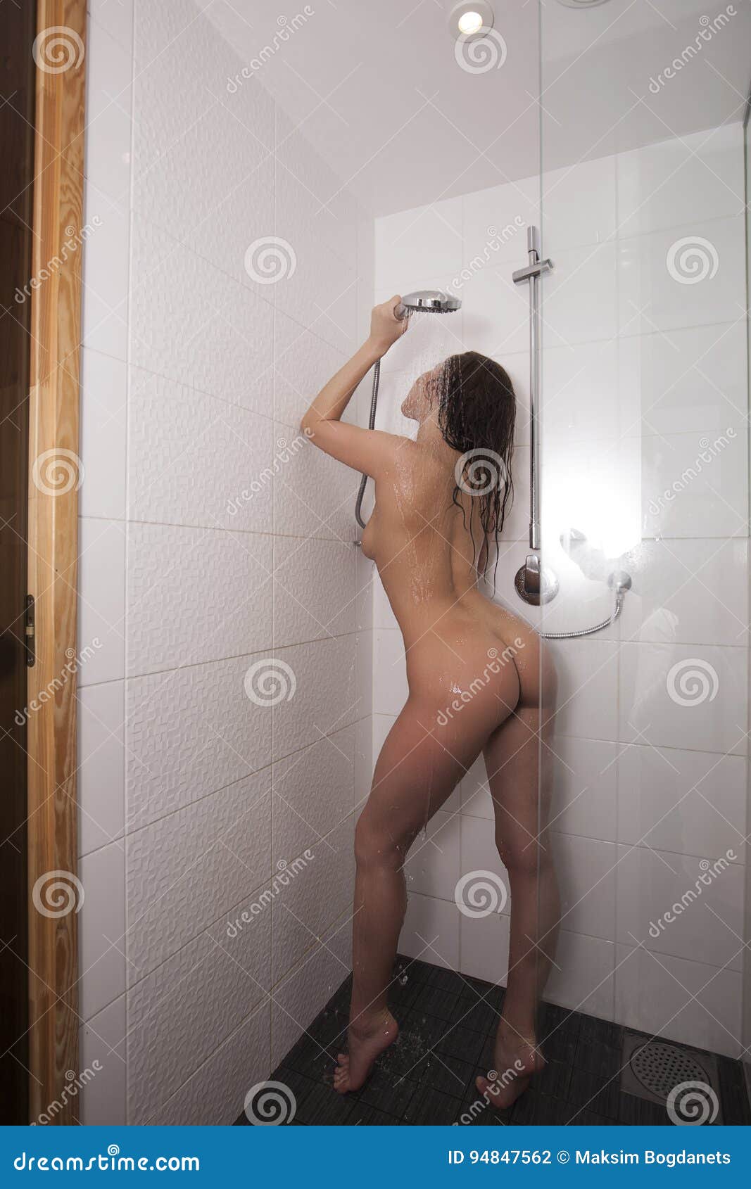 Dark haired girl goes out of shower and shows nude body
