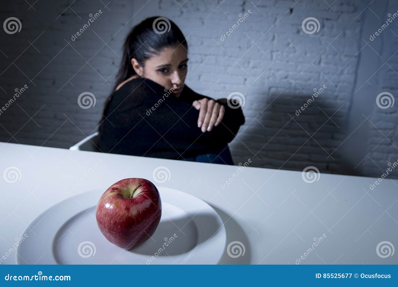 Young Woman or Teen Looking Apple Fruit on Dish As Symbol of Crazy Diet ...
