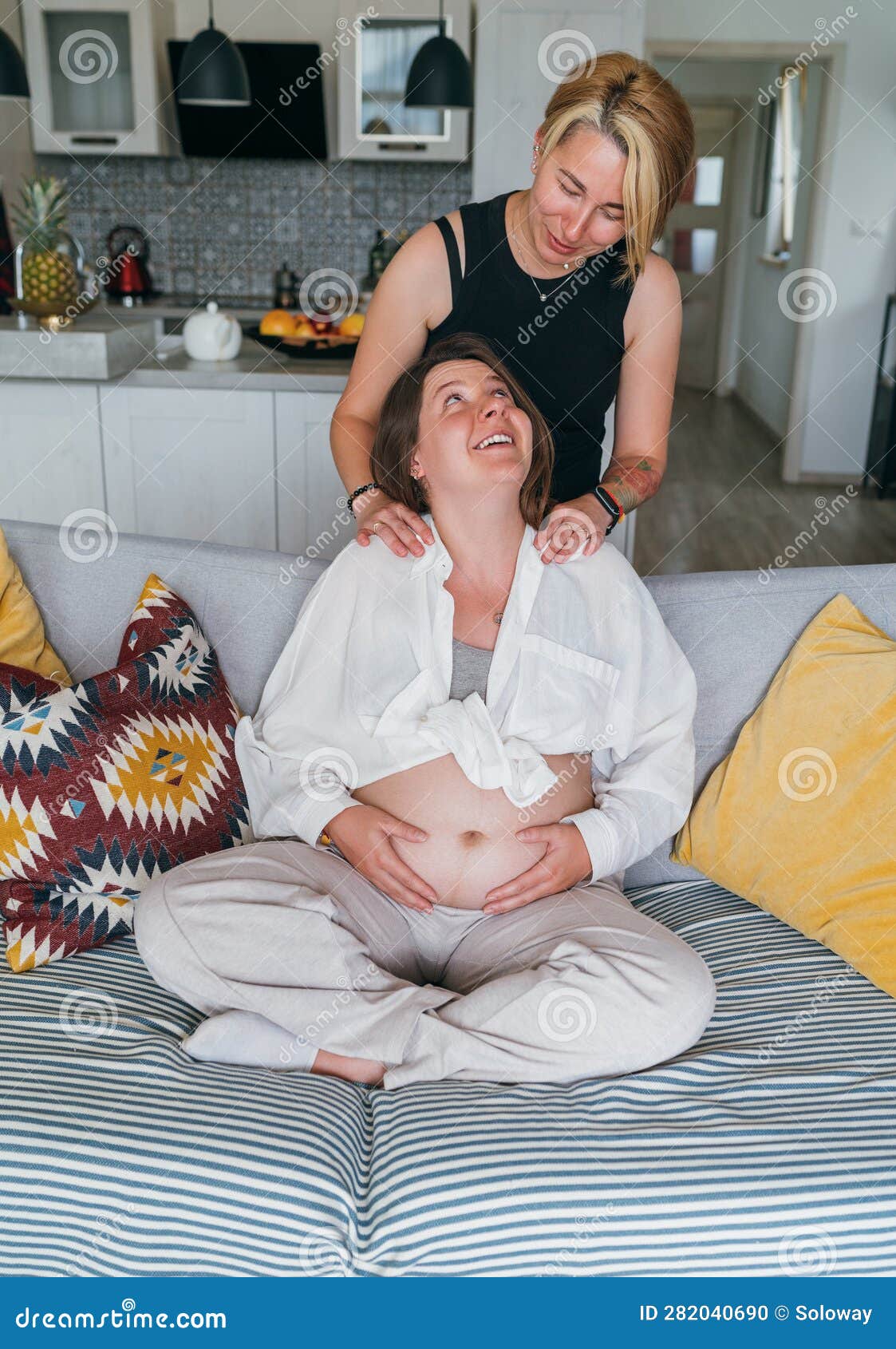 Young Woman Tender Touching Partner S Female Pregnant Belly image