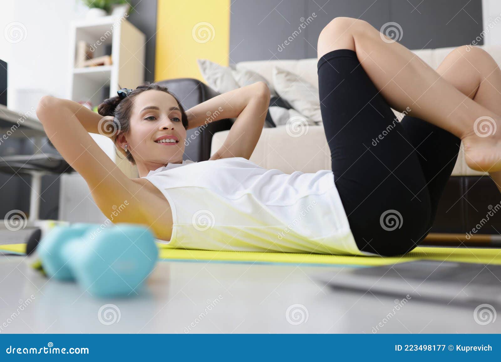 Young Woman Toned Abs on Rug at Home while Watching Video Guide on ...