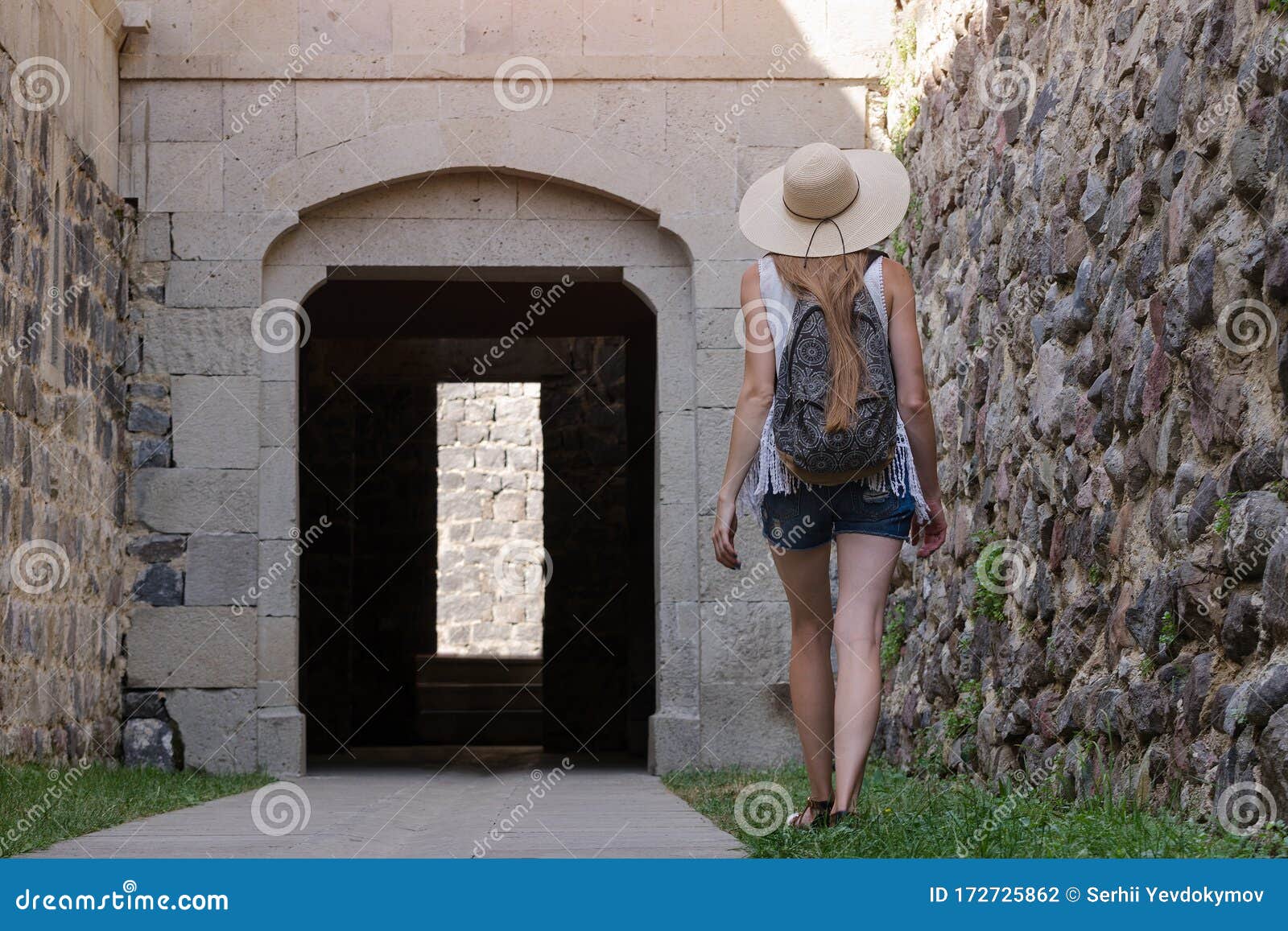 young woman tourist walking on ancient sites. excursions to ancient cities