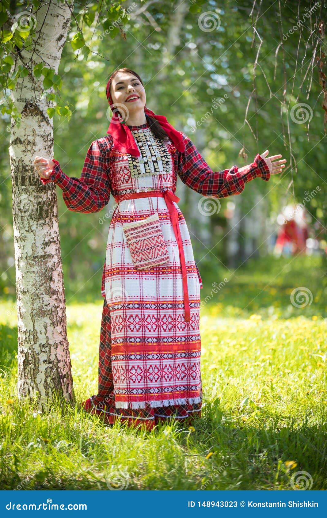 Young Woman in Traditional Russian Clothes Standing in the Forest and ...