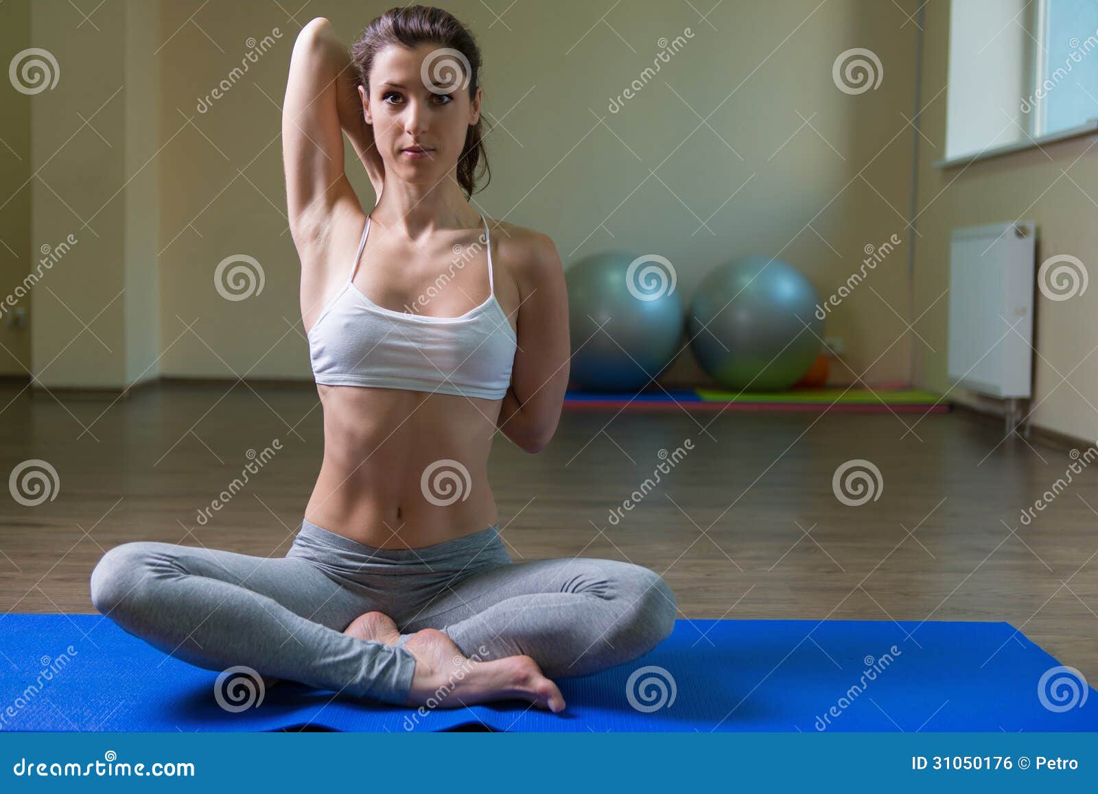 young woman training in yoga asana