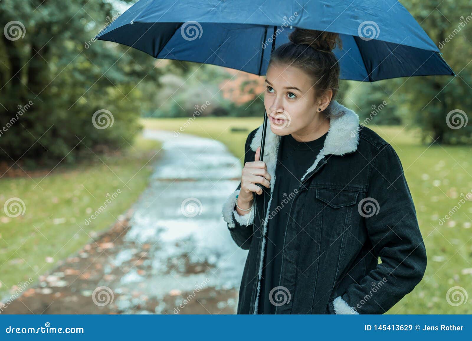 a young woman with umbrella waiting better weather a young woman with umbrella waiting better weather