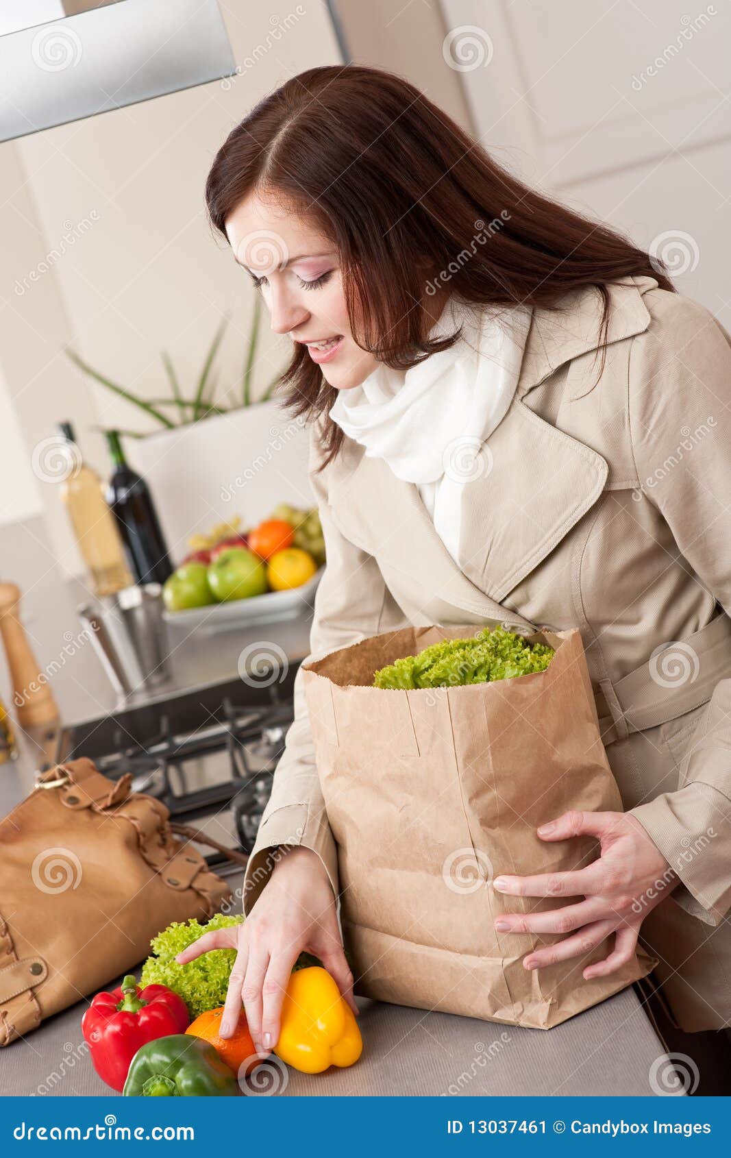 Young Woman Unpacking Shopping Bag in Kitchen Stock Image Image of