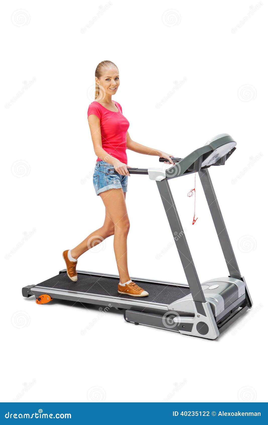 Young Woman Uses Treadmill. Stock Photo Image of cheerful