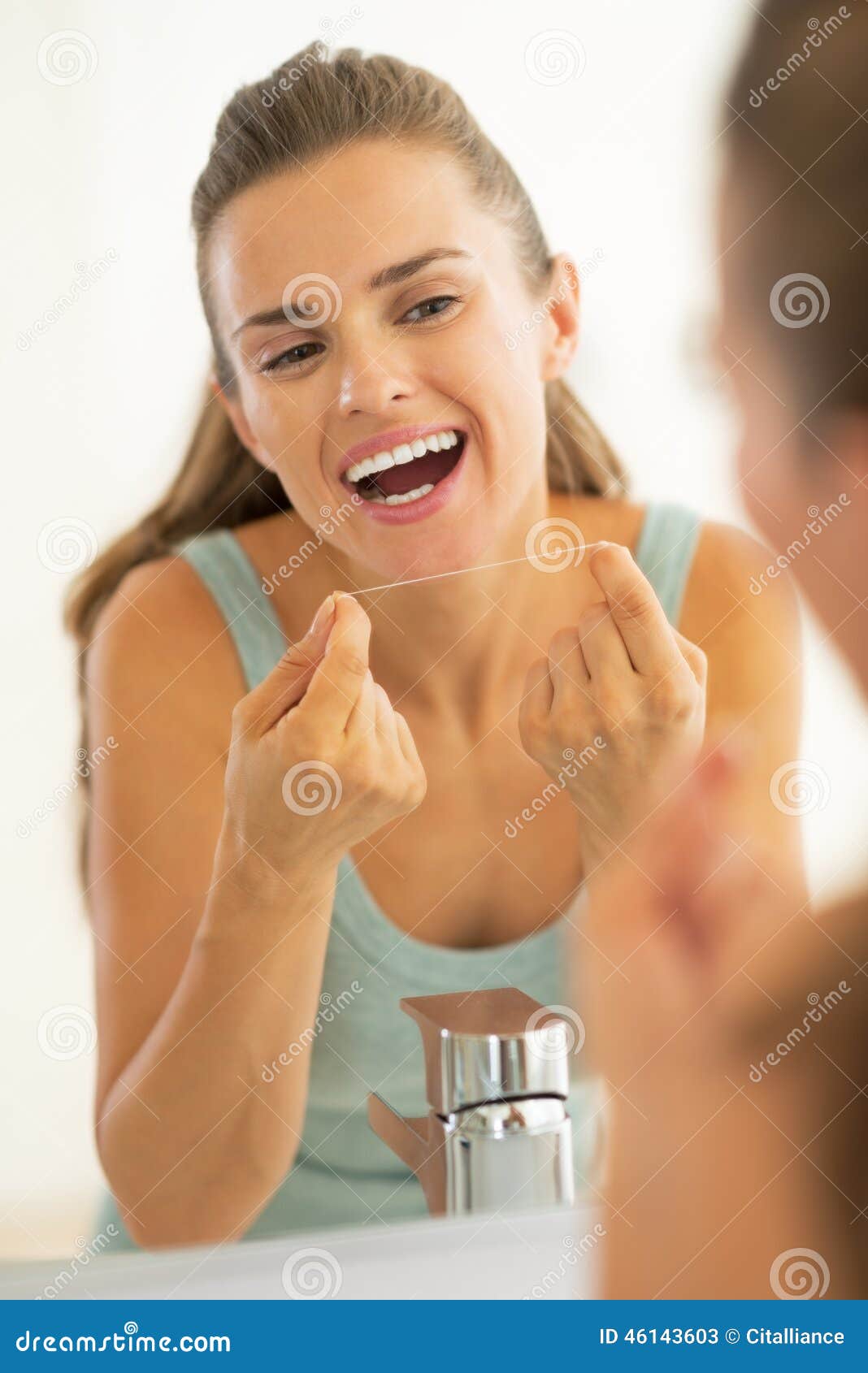 Young Woman Using Dental Floss in Bathroom Stock Image Image of