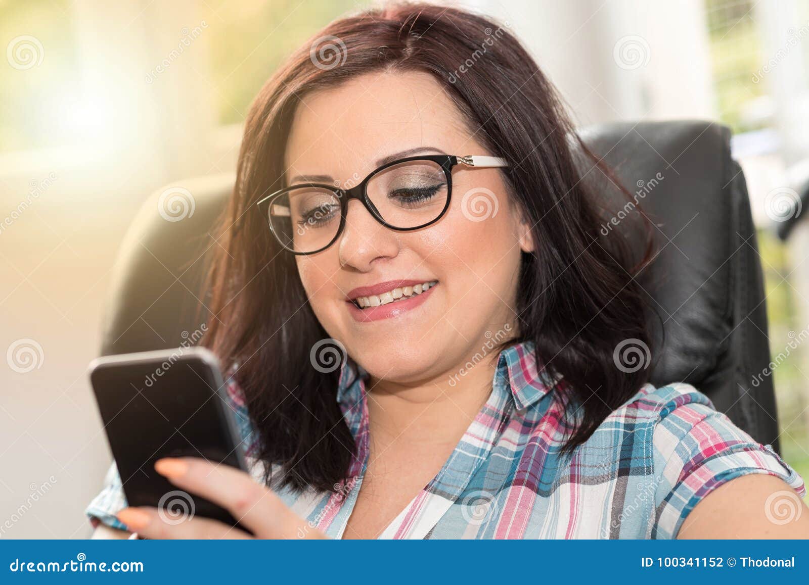 Young Woman Using Mobile Phone, Light Effect Stock Photo Image of