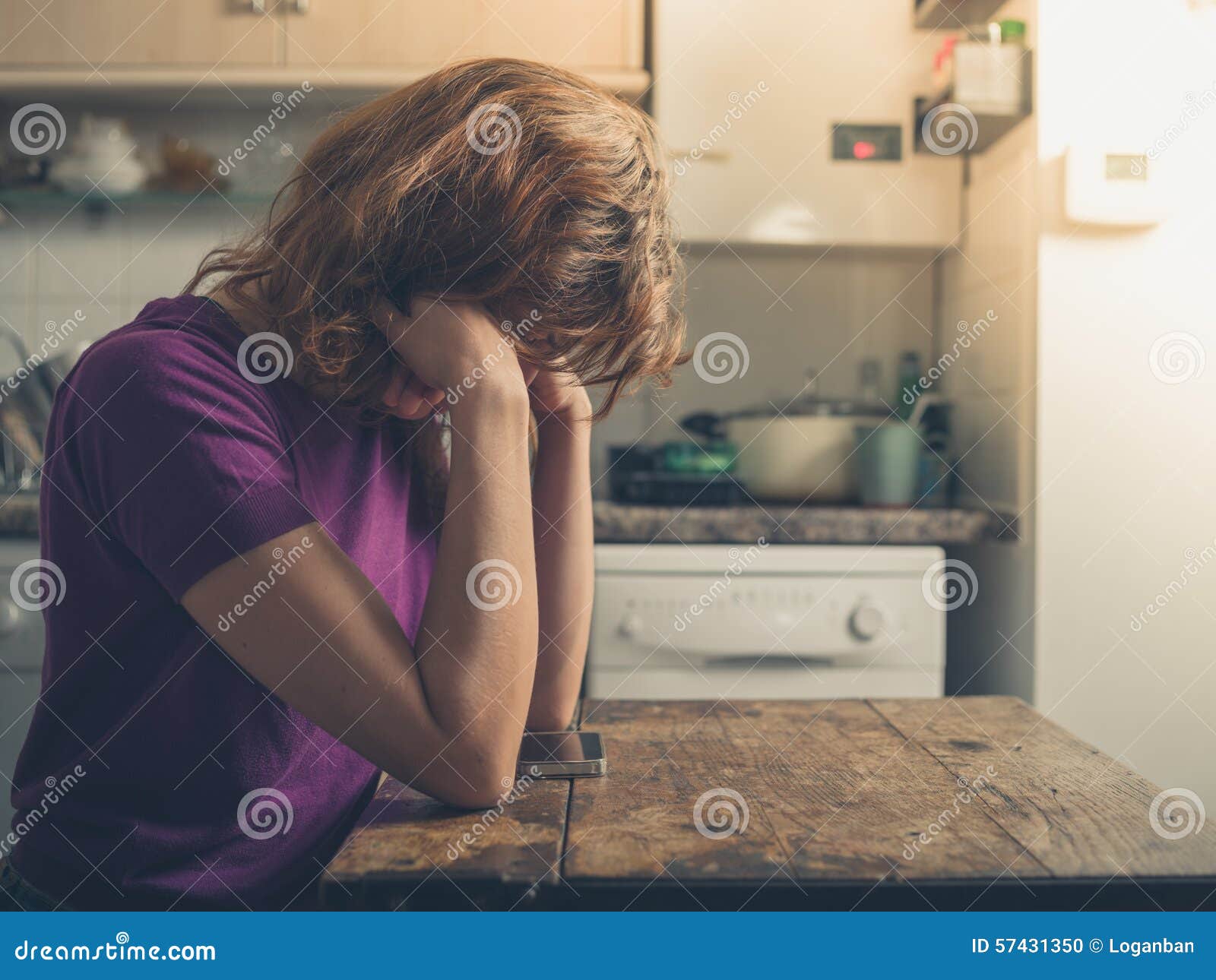 Young Woman Using Smart Phone in Kitchen Stock Photo Image of wooden