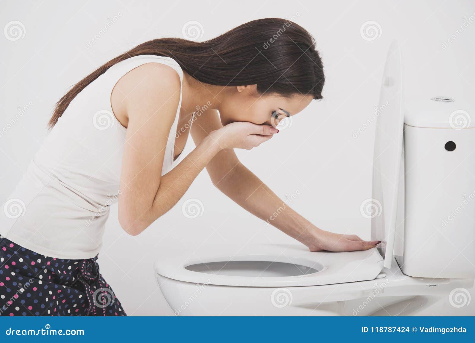 Young Woman Vomiting Into Toilet Bowl Stock Photo (Edit 