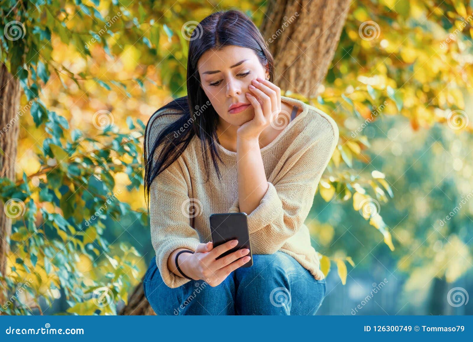 Sad Girl Watching Her Smartphone and Feeling Alone Waiting Social ...